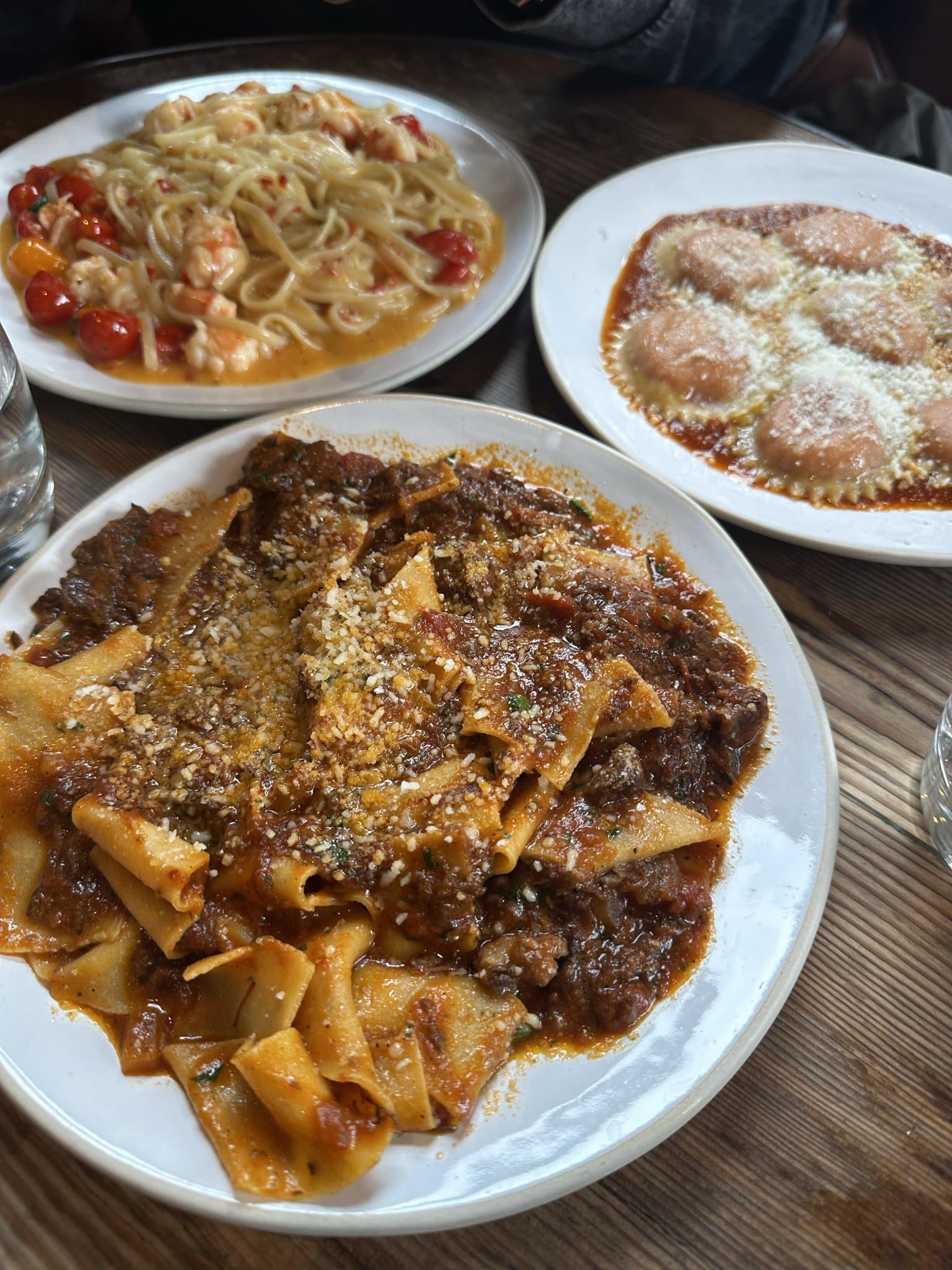 Pappardelle and a spread of plates on a table at a Bermondsey restaurant.