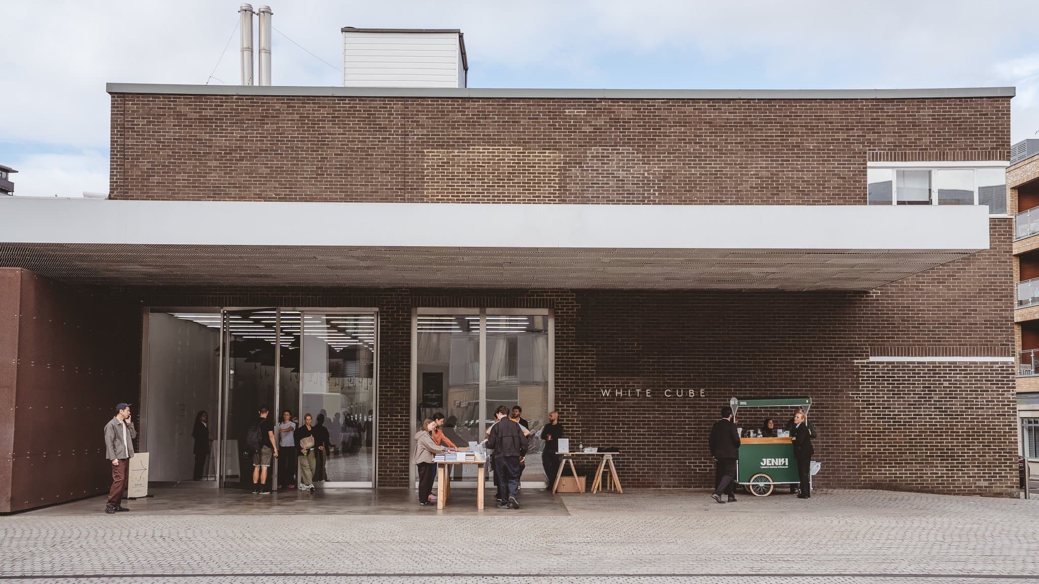 A gallery frontage on Bermondsey Street, people at a table outside.
