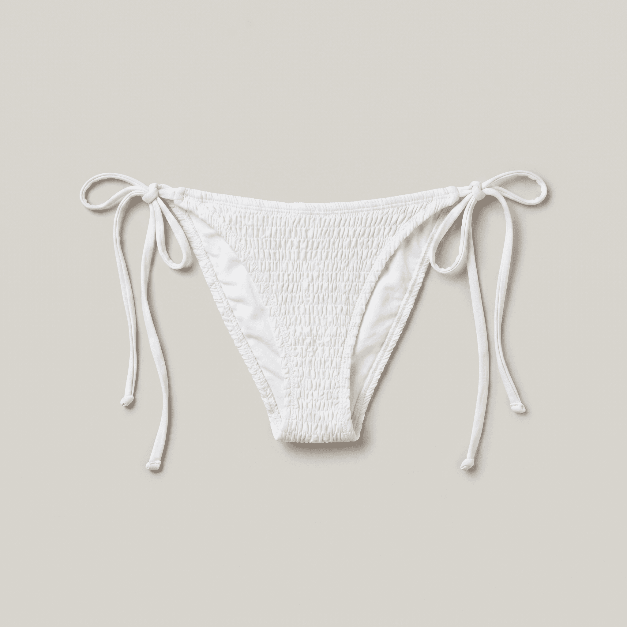EarthCove tie-side bikini bottom in white, flat lay